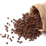 Coffee beans in sack on white